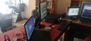 Stacks of photos being digitalized